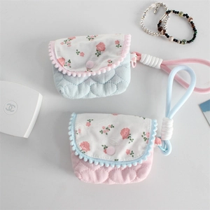 Quilted floral mini pouch with puffy heart pattern and colorful braided lanyard