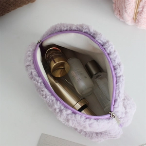 Top view of purple plush cosmetic bag showing spacious interior and soft texture