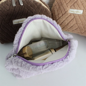 Plush quilted cosmetic bags in brown and lilac showing large storage capacity
