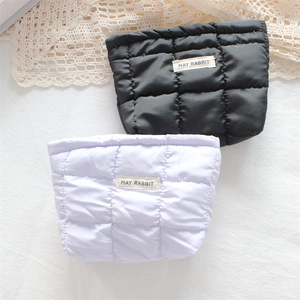 Quilted floral mini cosmetic bags in black and lilac with chic bow and label detail