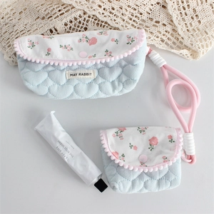 Quilted floral pencil pouch set with heart patterns, pom-pom trim and pink rope handles