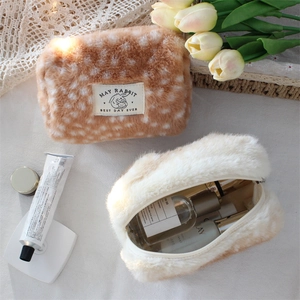 Detailed top view of soft plush fawn pattern cosmetic bags with ample interior storage space