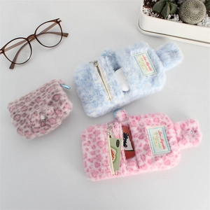 Plush leopard print mini coin purse and card holder with button closure and soft texture
