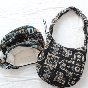 Detail of fleece tote bag featuring retro geometric pattern and zipped inner pocket