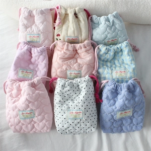 Quilted cotton camera pouch set with colorful patterns and drawstring closure