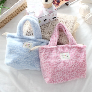 Plush faux fur leopard print tote bags in blue and pink with fuzzy soft texture