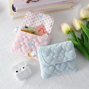 Quilted heart patterned small cotton pouches in pink and blue with snap closure