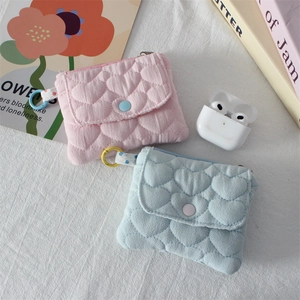 Quilted heart-pattern card holders in pink and blue with snap buttons and hook detail