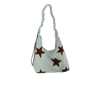 Star embroidered faux suede shoulder bag with adjustable scrunchie strap in mint green
