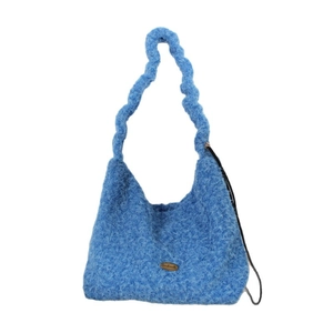 Light blue handmade plush tote bag with thick braided handles and woven texture