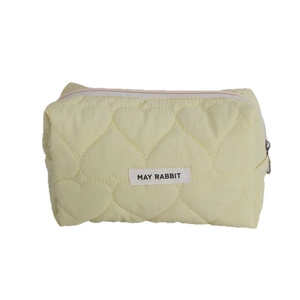 Quilted heart pattern makeup bag in pale yellow with May Rabbit label and top zipper