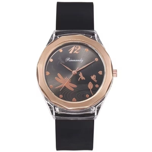 Octagonal rose gold watch with black silicone strap and butterfly floral patterns