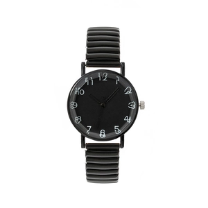 Montre à bracelet élastique noir avec cadran à chiffres blancs de style artistique