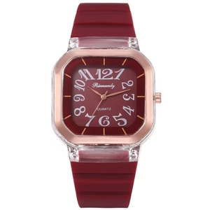 Square quartz watch with red silicone strap and rose gold metal case on white background