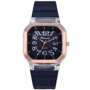 Minimalist square quartz watch with blue silicone strap and rose gold bezel detail