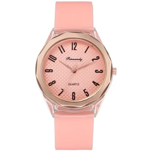 Detailed macro of pink silicone watch strap with rose gold octagonal metal bezel