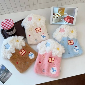 Detail of plush water bottle covers in house shape with snowman and star embroidery