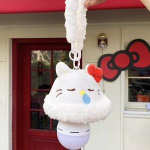 Detail of Hello Kitty plush wall night light with red bow on a themed background