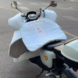 Close-up of thick fleece lining and cartoon puppy design on winter electric scooter cover