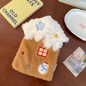 Detail of cozy house-shaped plush hot water bottle cover with snowman and star embroidery