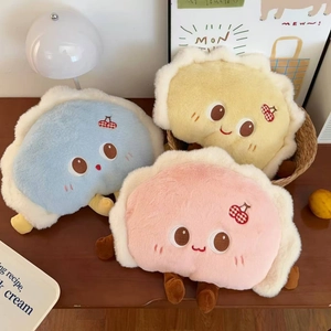 Close-up of plush cartoon dumpling electric heat bags with cute embroidery and soft textures