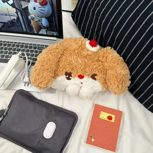 Close-up of cute cartoon plush dog cover with soft coral fleece texture on a bed