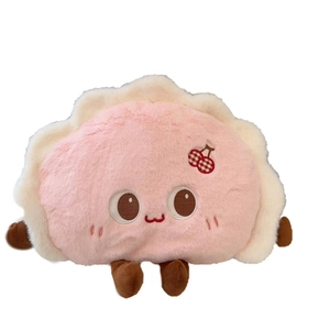 Cute pink dumpling-shaped electric hot water bag with cherry detail on white background