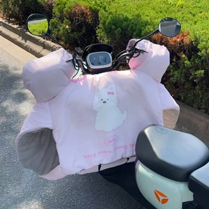 Close-up of pink winter motorcycle apron with plush lining and cute cartoon dog design