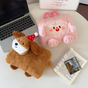 Close-up of cute plush cartoon hot water bags with festive Christmas dog and pink bunny