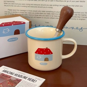 Detail view of cartoon ceramic mug with wooden spoon and premium gift box packaging