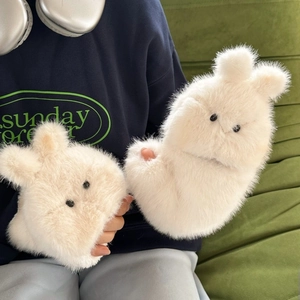Close-up of white plush bear convertible gloves with fuzzy faux fur and cute 3D ears