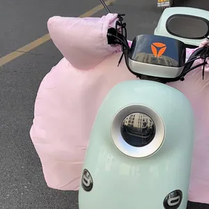 Pink waterproof scooter leg cover with plush lining and integrated handlebar muffs