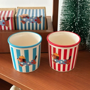Striped ceramic puppy mugs in red and blue, featuring cute dachshund illustrations