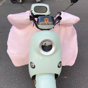 Close-up of pink quilted waterproof scooter leg cover with integrated handlebar mittens