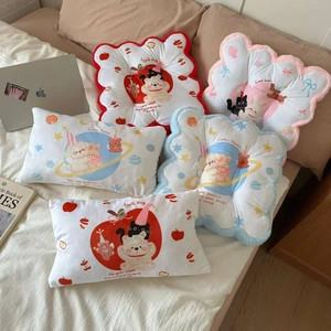 Detailed view of plush cartoon chair cushions with cute bear and cat illustrations