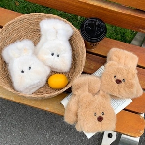 Detail of plush bear and rabbit convertible gloves with soft faux fur texture