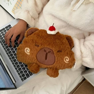 Macro detail of brown plush bear hot water bag featuring soft fur and cherry embroidery