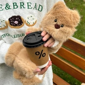 Detailed macro of plush bear mittens showing soft khaki faux fur and warm lining