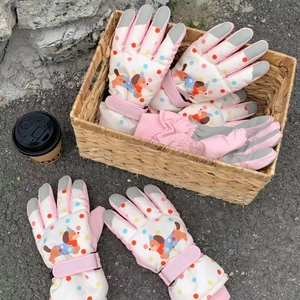 Pink cartoon puppy ski gloves with colorful polka dots and adjustable wrist strap
