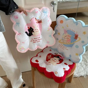 Close-up of fluffy cartoon backrest cushions with colorful floral edges and cute animal prints