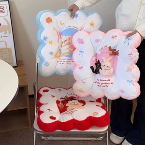 Close-up of thick plush cartoon seat cushions with cute rabbit and bear embroidery
