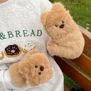 Close-up of cute teddy bear plush gloves with thick windproof fur and soft texture