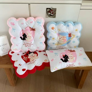 Detailed view of plush cartoon backrests and cushions with cute cat and rabbit designs