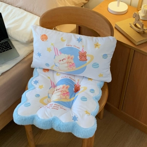 Detail of cartoon astronaut dog plush seat cushion and backrest on a wooden chair