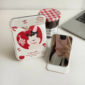 Foldable vanity mirror featuring a cute cartoon bear and cat illustration on a white cover