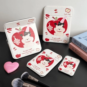 Detail of cute bear and apple illustration on beige foldable vanity mirrors