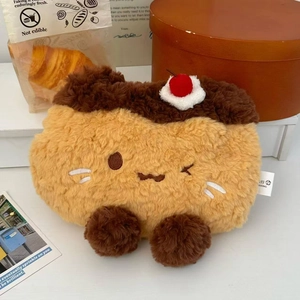 Detail of pudding cake plush storage bag with cherry decor and cute embroidered face