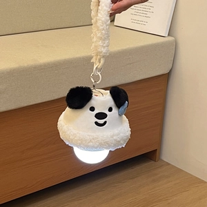 Detail of cute panda plush wall night light with curly hanging strap for room decor