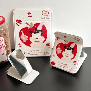Foldable vanity mirror with cute apple bear illustration and cream leather cover