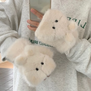 Close-up of plush bear paw flip cover gloves in cream white faux fur material